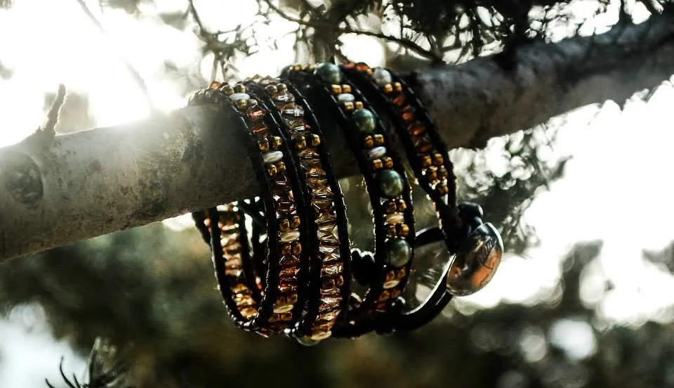 Wrap bracelets on a branch in golden sunlight